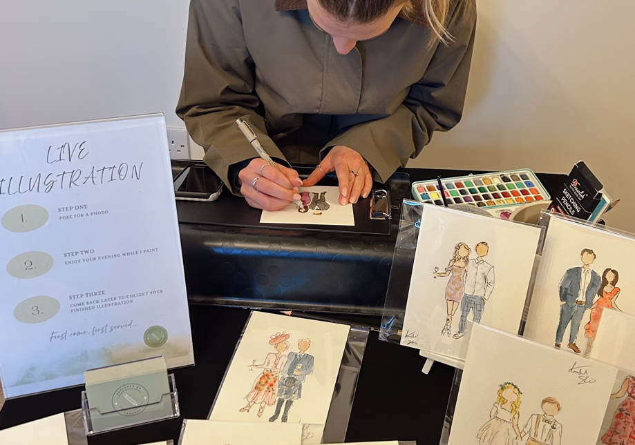 Live wedding illustration by Sketched by Annabel, capturing guests with quick, expressive pen and watercolour sketches during the celebration.